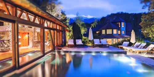 Swimming pool, spa and gym at night at Las Balsas Gourmet Hotel